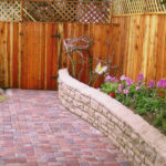 Wood fence pavingstone walk wood fence and block wall garden bed
