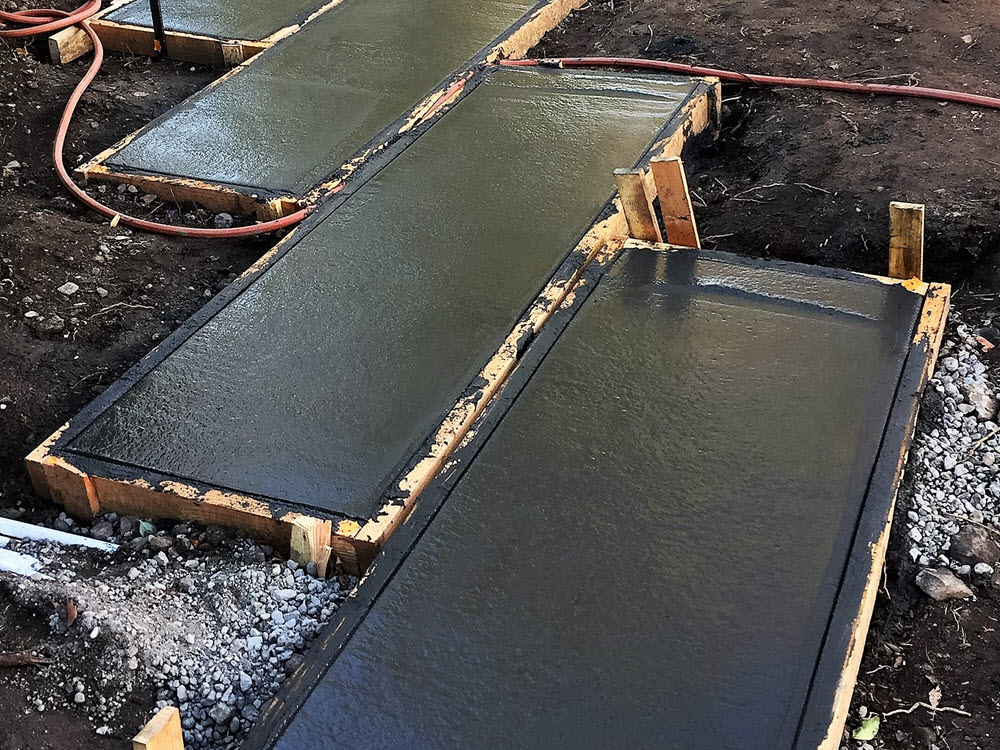 Ed's Landscaping black cement slab project underconstruction